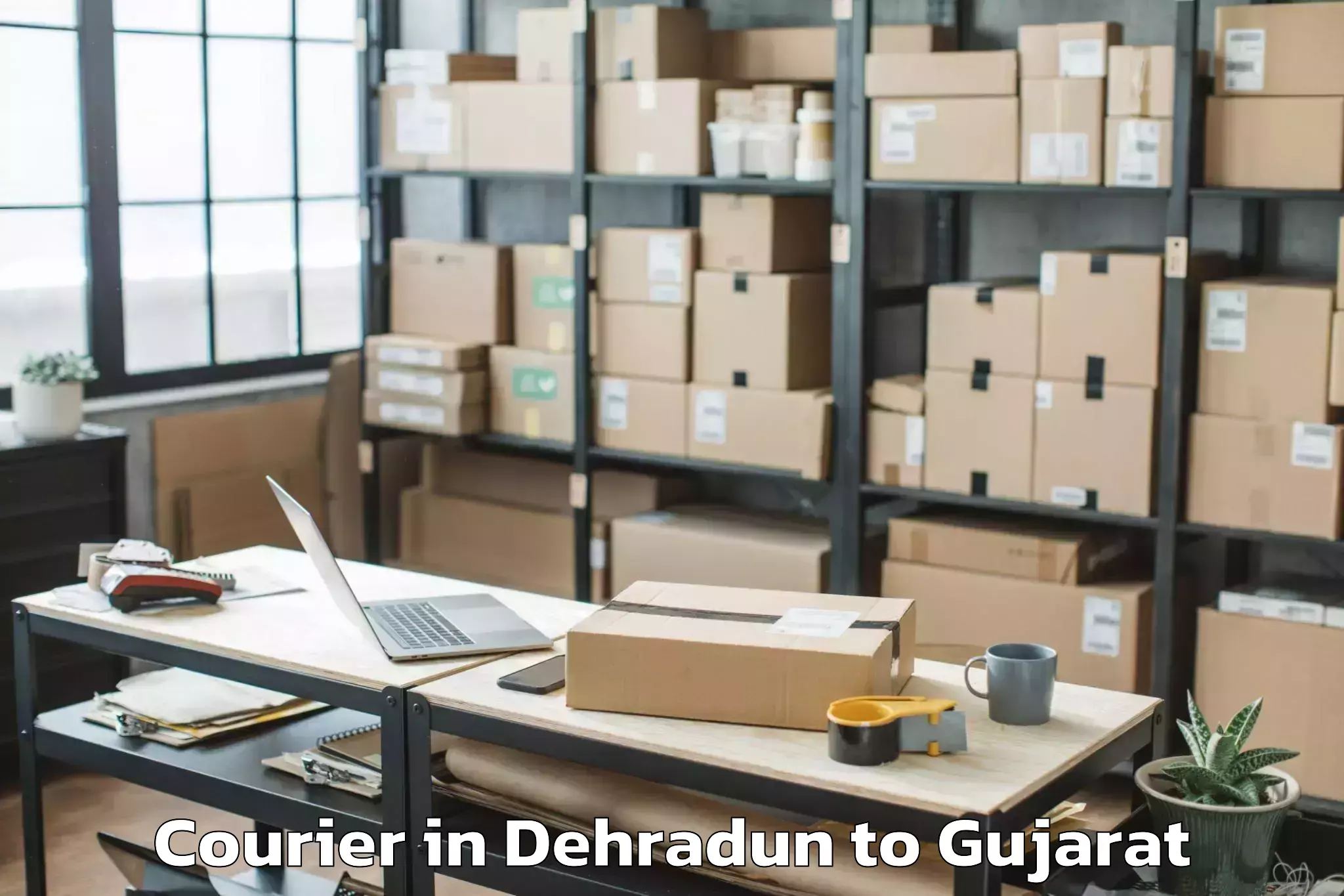 Trusted Dehradun to Gandevi Courier